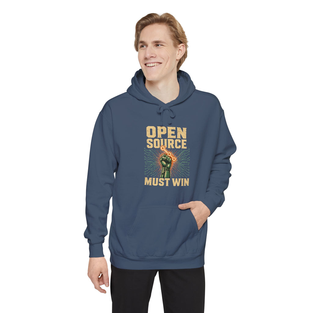 Open Source Must Win — Garment-Dyed Hoodie — Open Source Must Win — robotic fist holding a git branch, vintage propaganda style